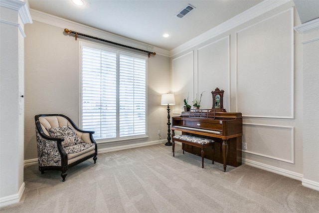 living area featuring light carpet and ornamental molding