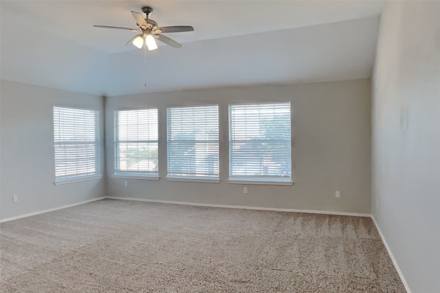 spare room featuring ceiling fan and carpet flooring