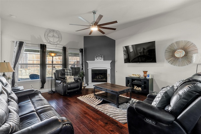 living room with ceiling fan, dark hardwood / wood-style flooring, and lofted ceiling