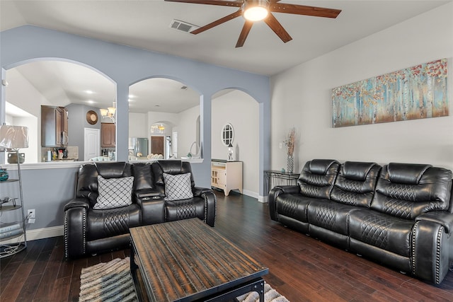 living room with vaulted ceiling, ceiling fan, and dark hardwood / wood-style floors