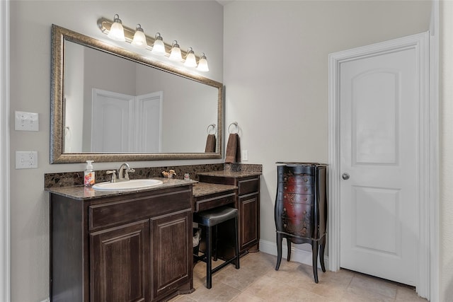 bathroom featuring tile patterned flooring and vanity