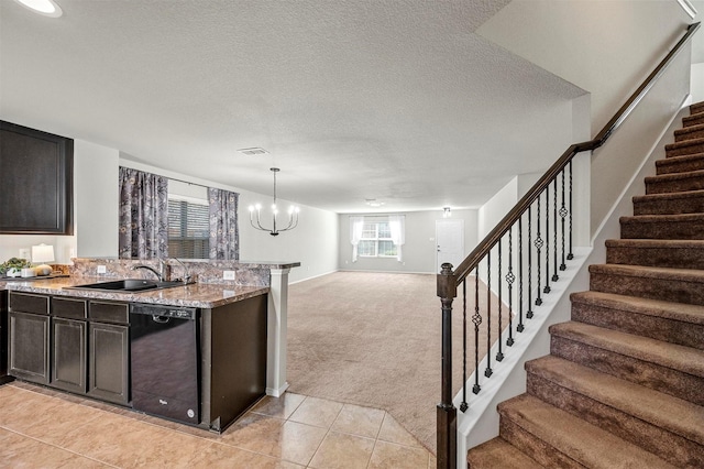 kitchen featuring black dishwasher, open floor plan, light carpet, a sink, and a textured ceiling