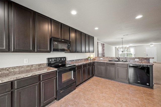 kitchen featuring a peninsula, dark brown cabinets, black appliances, a sink, and recessed lighting