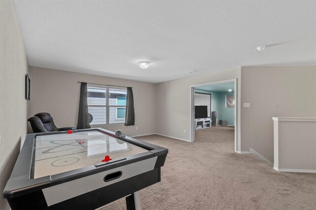 game room with light colored carpet