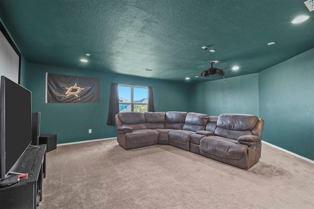 carpeted home theater with a textured ceiling, visible vents, and baseboards