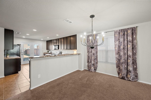 kitchen featuring light tile patterned flooring, recessed lighting, light colored carpet, stainless steel appliances, and visible vents