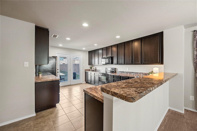 kitchen featuring dark brown cabinetry, light tile patterned floors, visible vents, black appliances, and recessed lighting