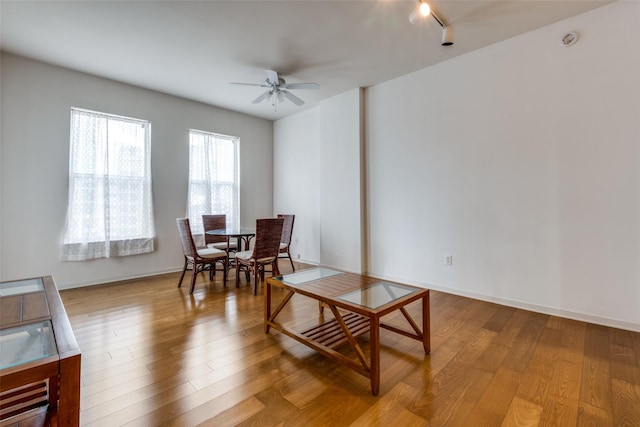 dining room with light hardwood / wood-style floors and ceiling fan