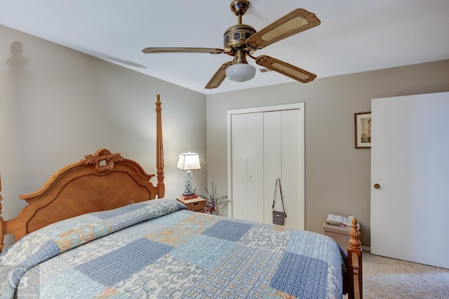 carpeted bedroom with ceiling fan and a closet