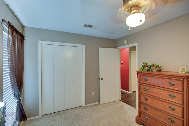 bedroom featuring ceiling fan and a closet