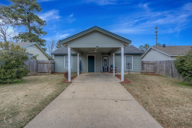 bungalow-style home featuring a carport and a front yard