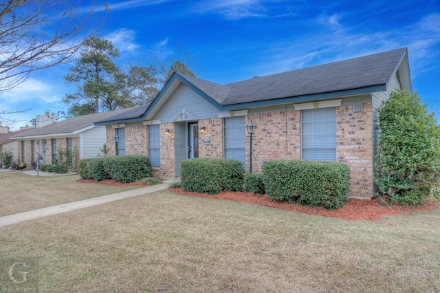 ranch-style home with a front yard