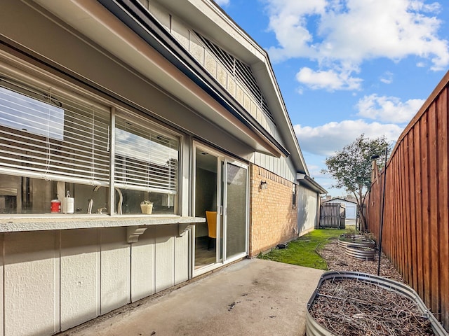 view of side of home featuring a patio