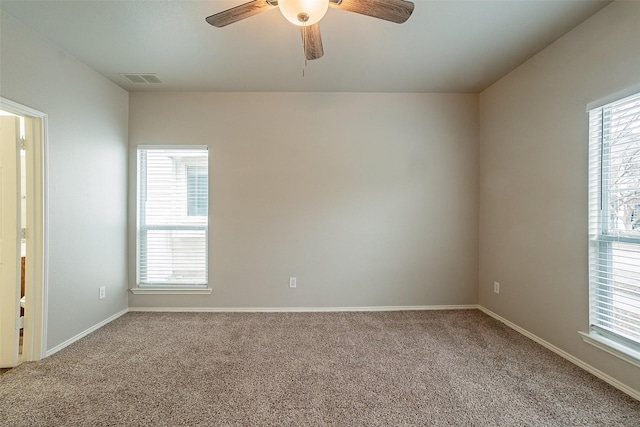 spare room with carpet and ceiling fan