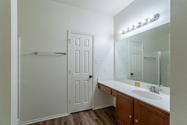 bathroom featuring hardwood / wood-style floors and vanity