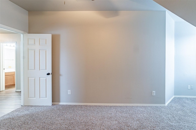 empty room featuring light carpet