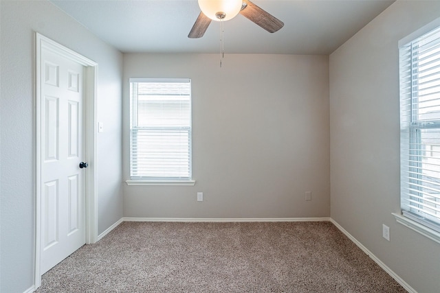 carpeted empty room with ceiling fan