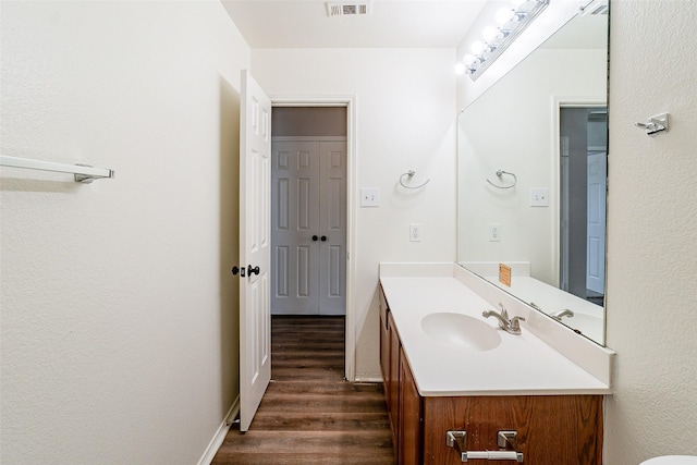 bathroom featuring hardwood / wood-style floors and vanity