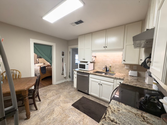 kitchen featuring exhaust hood, stainless steel dishwasher, sink, white cabinets, and light stone counters