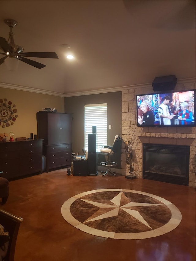 living room featuring ceiling fan, a fireplace, and crown molding