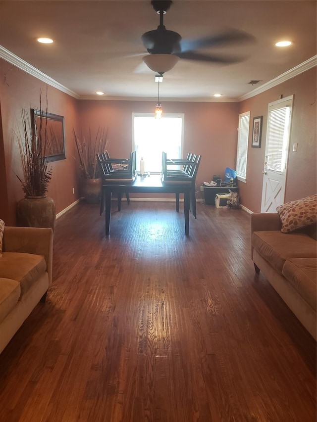 interior space with ceiling fan, dark hardwood / wood-style flooring, and crown molding