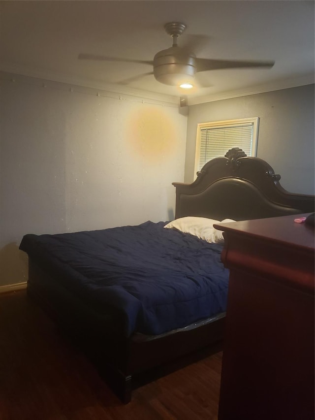 bedroom with ceiling fan and hardwood / wood-style flooring