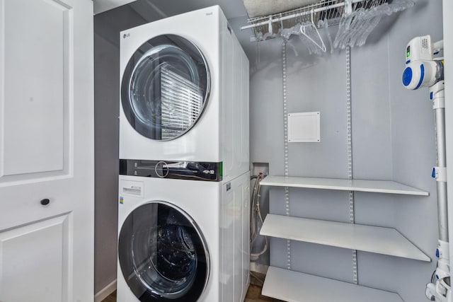 laundry area with stacked washer / dryer