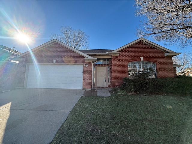 single story home with a front yard and a garage