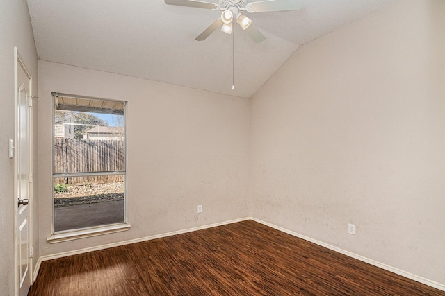 empty room with hardwood / wood-style flooring, ceiling fan, and lofted ceiling