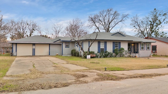 ranch-style house with a front yard and a garage