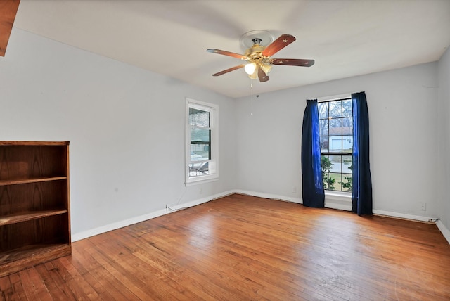 spare room featuring ceiling fan and light hardwood / wood-style floors