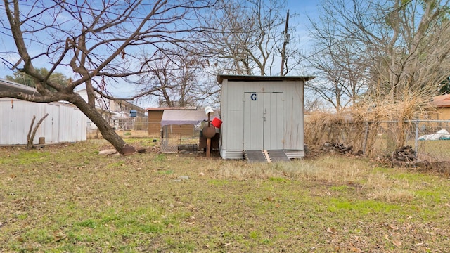 view of outbuilding featuring a yard