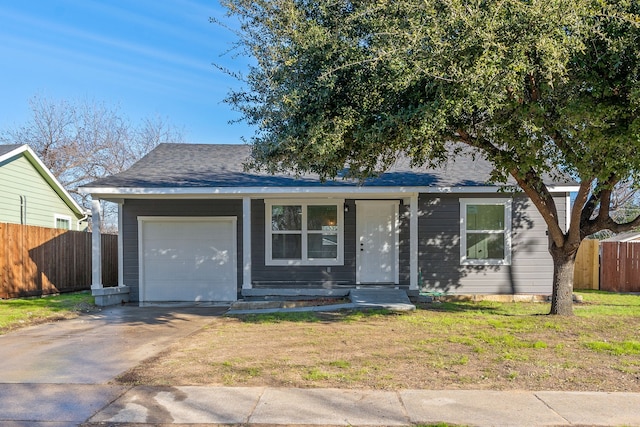 view of front facade with a front yard and a garage