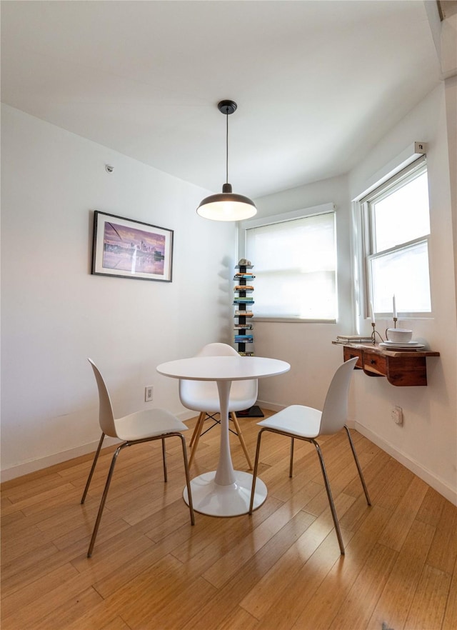 dining room with light hardwood / wood-style floors