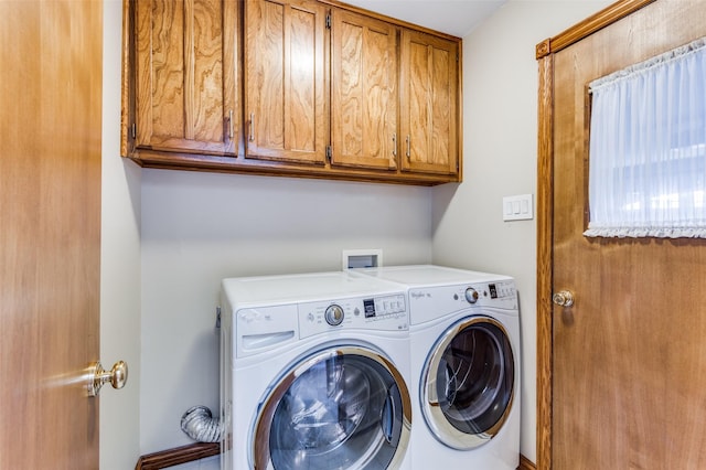 laundry room with cabinets and independent washer and dryer