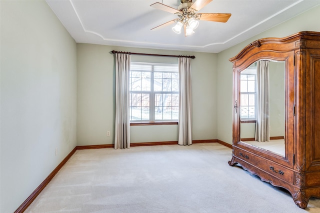 interior space with ceiling fan