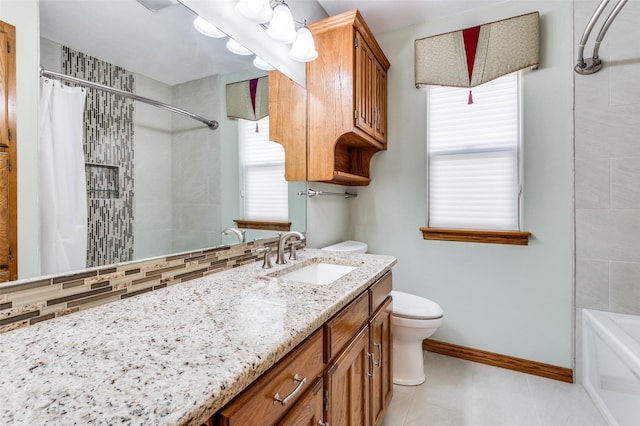 bathroom with tasteful backsplash, vanity, and toilet