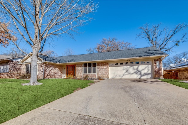 ranch-style home featuring a front lawn and a garage