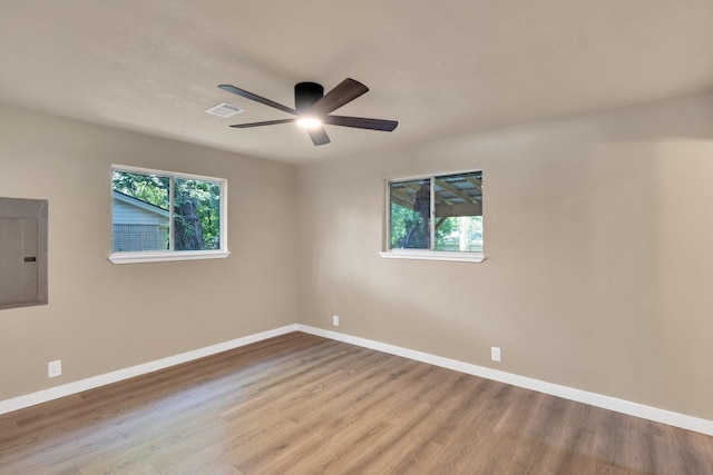 3482 Bandera Rd, Fort Worth, TX 76116 - spare room with electric panel, wood finished floors, a ceiling fan, and baseboards