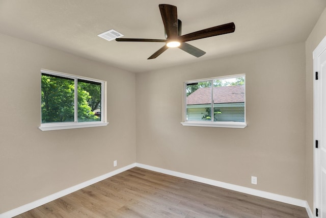 3482 Bandera Rd, Fort Worth, TX 76116 - empty room with healthy amount of natural light, ceiling fan, baseboards, and wood finished floors