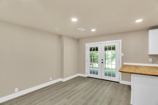 3482 Bandera Rd, Fort Worth, TX 76116 - unfurnished dining area with french doors, light wood-style flooring, baseboards, and recessed lighting