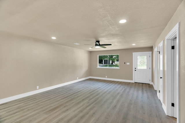 3482 Bandera Rd, Fort Worth, TX 76116 - unfurnished living room with ceiling fan, wood finished floors, a textured ceiling, recessed lighting, and baseboards