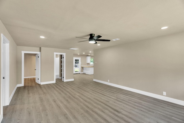 3482 Bandera Rd, Fort Worth, TX 76116 - unfurnished living room with light wood finished floors, a ceiling fan, baseboards, and recessed lighting