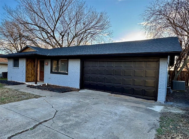 3482 Bandera Rd, Fort Worth, TX 76116 - view of front facade with brick siding, central AC, driveway, and a shingled roof