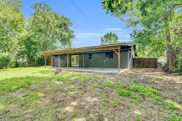 3482 Bandera Rd, Fort Worth, TX 76116 - rear view of house featuring french doors, a fenced backyard, a patio area, and brick siding