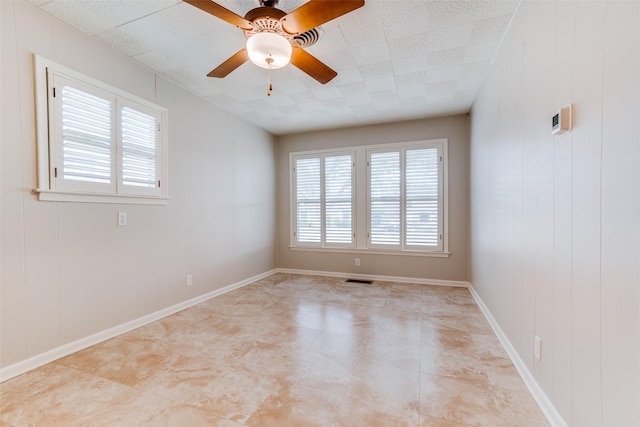 unfurnished room with ceiling fan