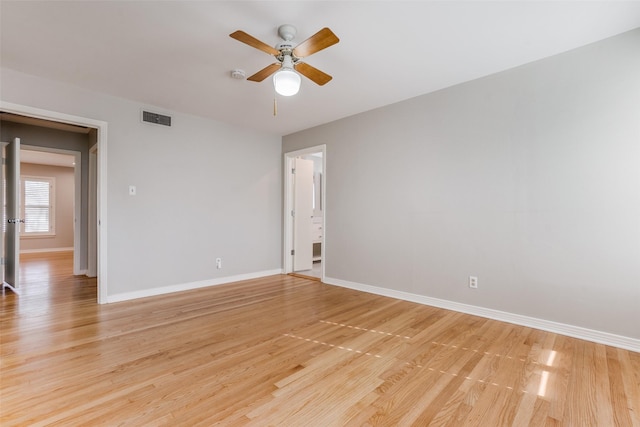 spare room with ceiling fan and light hardwood / wood-style floors