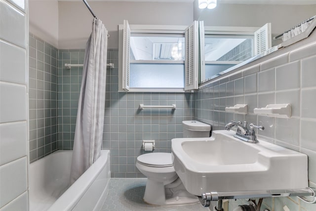 full bathroom featuring tile walls, tile patterned floors, and shower / tub combo with curtain