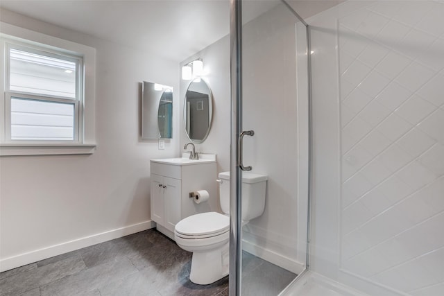 bathroom with toilet, a shower with shower door, and vanity