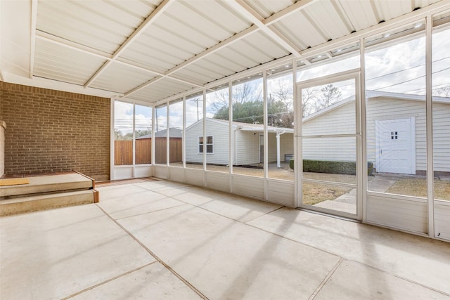 unfurnished sunroom with plenty of natural light